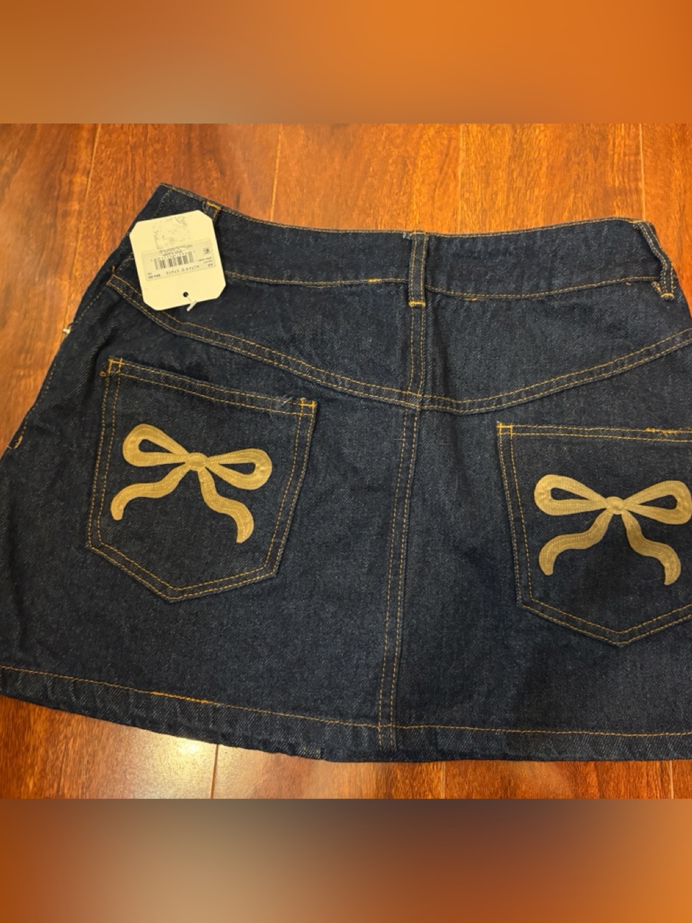 Altar'd State Dark Indigo Denim Mini Skirt with Tan Bow Embroidery